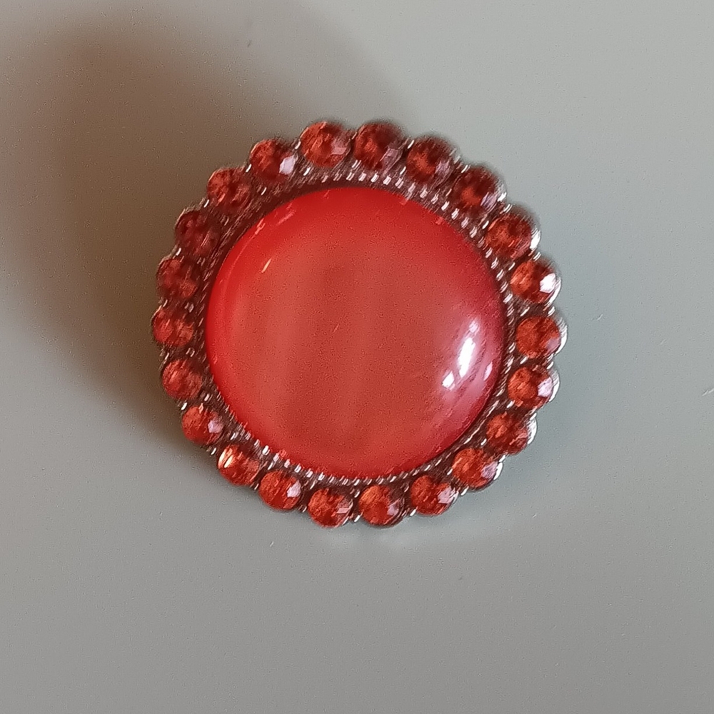 Vintage-Inspired Orange and Silver Brooch with Ornate Design